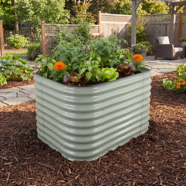 Corrugated medium metal garden planter with plants and flowers in a backyard setting