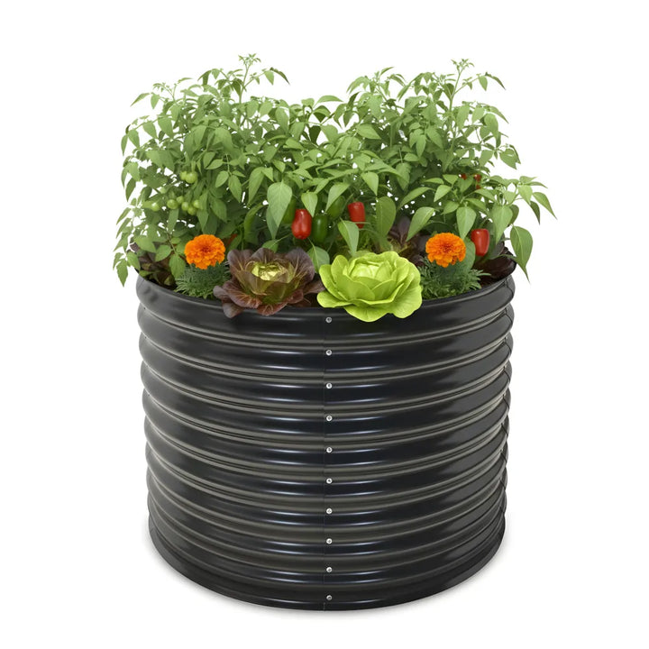 Black corrugated plastic planter with plants on a white background